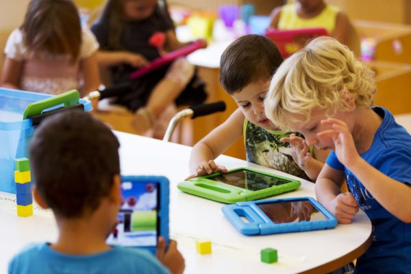 Students play with their iPads at the Steve Jobs school in Sneek August 21, 2013. The Steve Jobs schools in the Netherlands are founded by the O4NT (Education For A New Time) organisation, which provides the children with iPads to help them learn with a more interactive experience. REUTERS/Michael Kooren (NETHERLANDS - Tags: SOCIETY EDUCATION SCIENCE TECHNOLOGY) - RTX12S7O